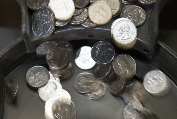 clean coins falling into a sorting machine