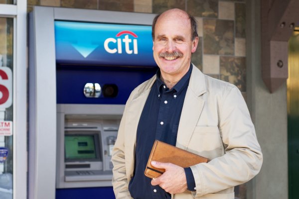 Tech analyst Paul Saffo in front of an ATM in Silicon Valley
