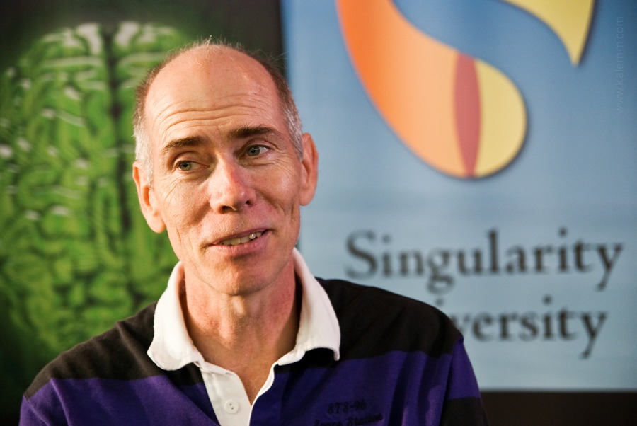 Singularity University teacher, former astronaut Dan Barry, with Singularity University logo