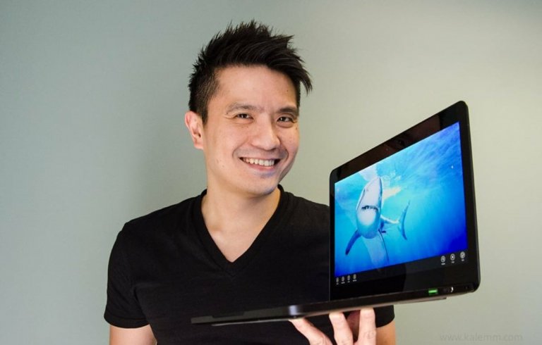 Razer CEO Min Lian Tan holding a gaming laptop