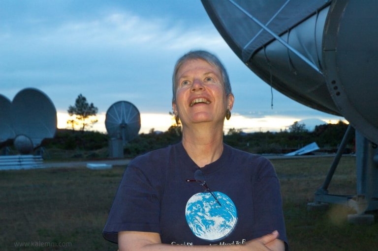 Portrait photo of SETI Institute Director Jill Tarter, surrounded by satellite dishes at the Allen Telescope Array in Northern California