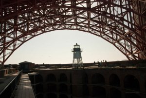 A small lighthouse at Fort Point and the Golden Gate Bridge in San Francisco