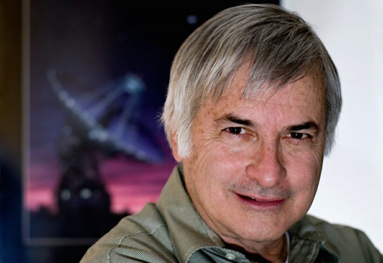 Seti Institute researcher Seth Shostak with an image of a satellite dish