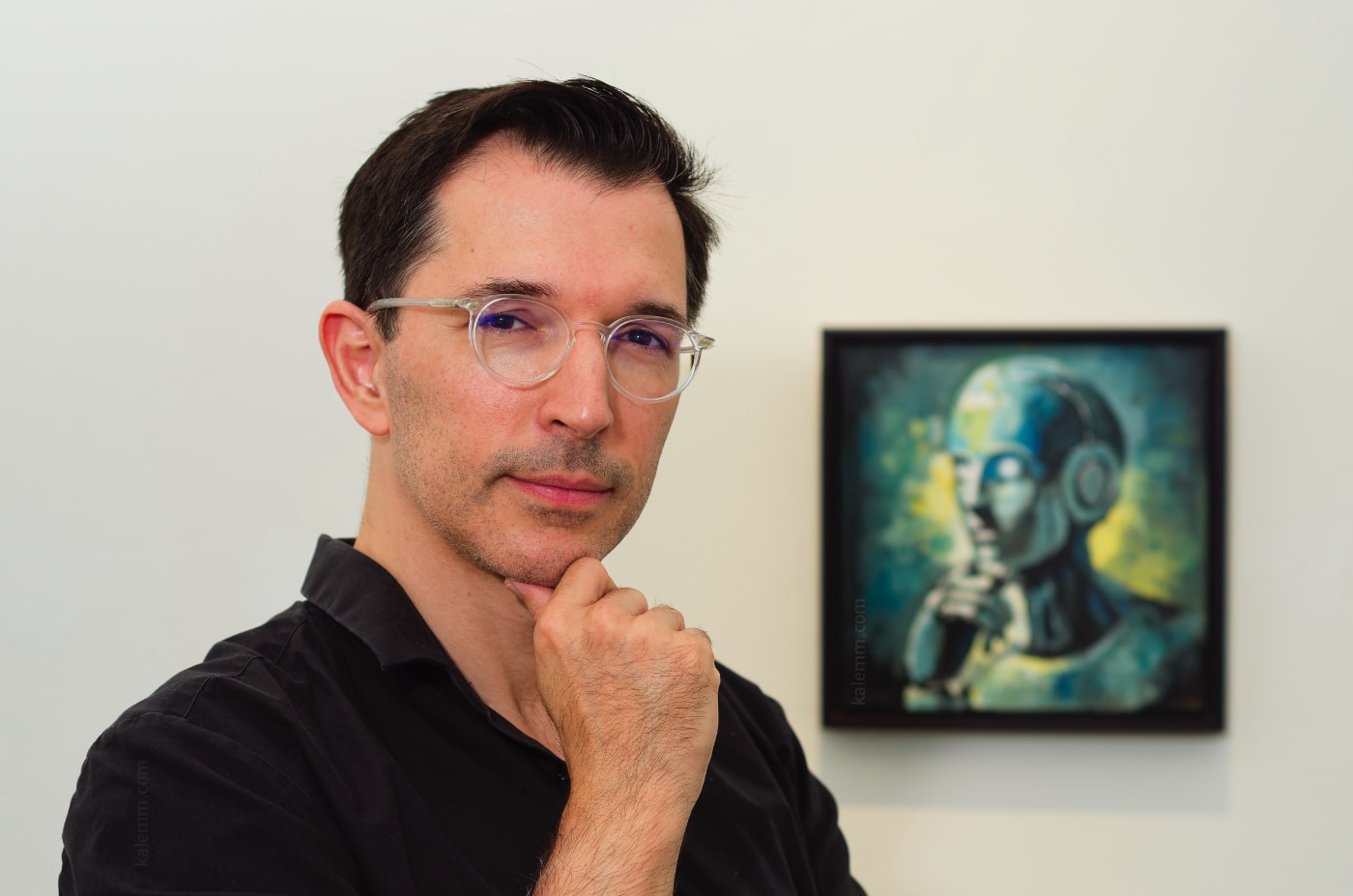 portrait of AI researcher Iyad Rahwan in front a painting of ChatGPT